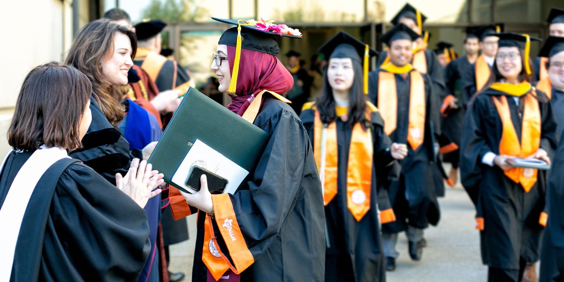 UT Dallas information systems graduates, including master's in business analytics majors