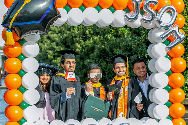 Jindal School students on UT Dallas commencement day, including master's in business analytics graduates